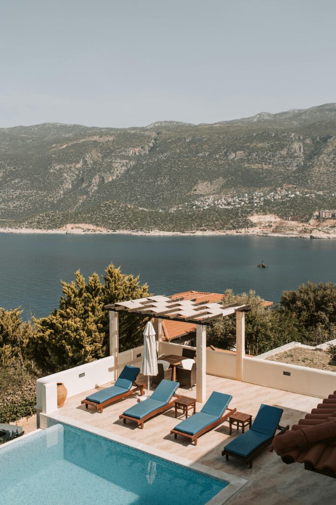 Stunning poolside view from a luxurious villa in Antalya, Turkey, over blue waters.